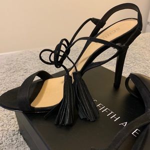 Black suede tassel heels